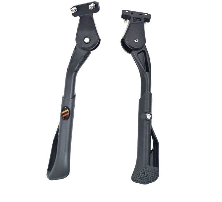 Pair of black motorcycle foot pegs on a white background
