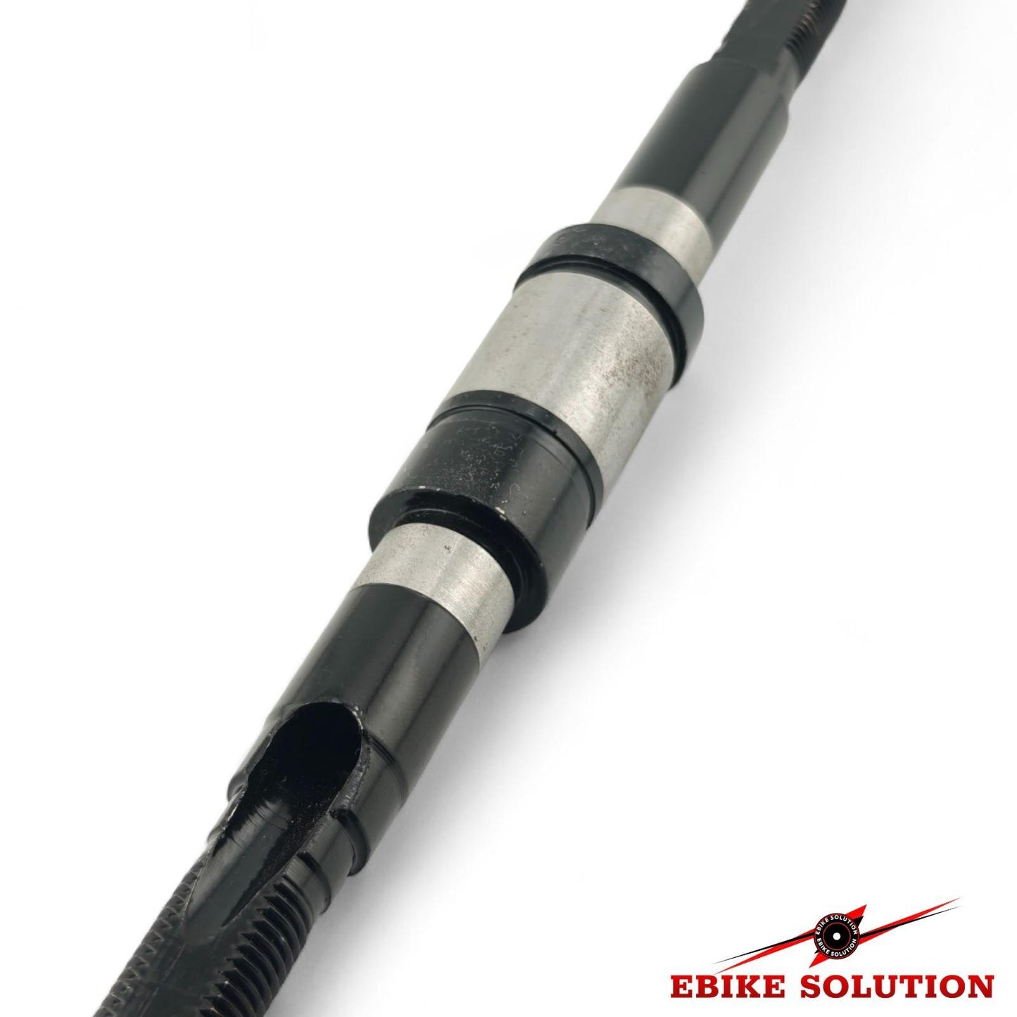 Close-up of a mechanical component with 'Ebike Solution' branding on a white background