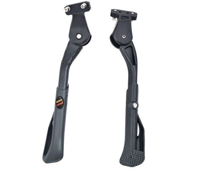 Pair of black motorcycle foot pegs on a white background