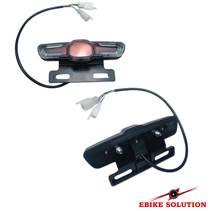 Two motorcycle lights with wiring on a white background, branded 'Ebike Solution'.